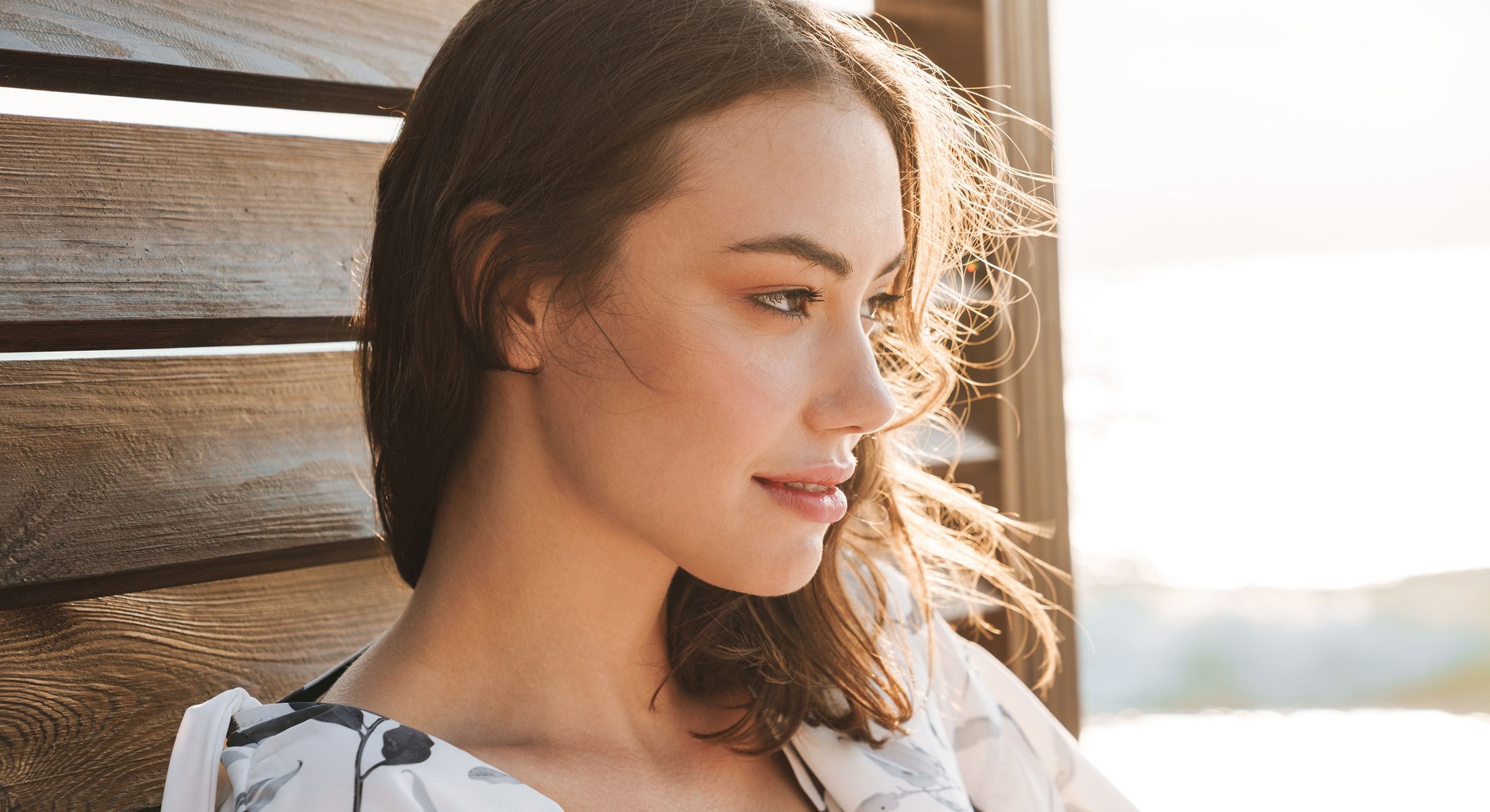 Model with long hair against white background.