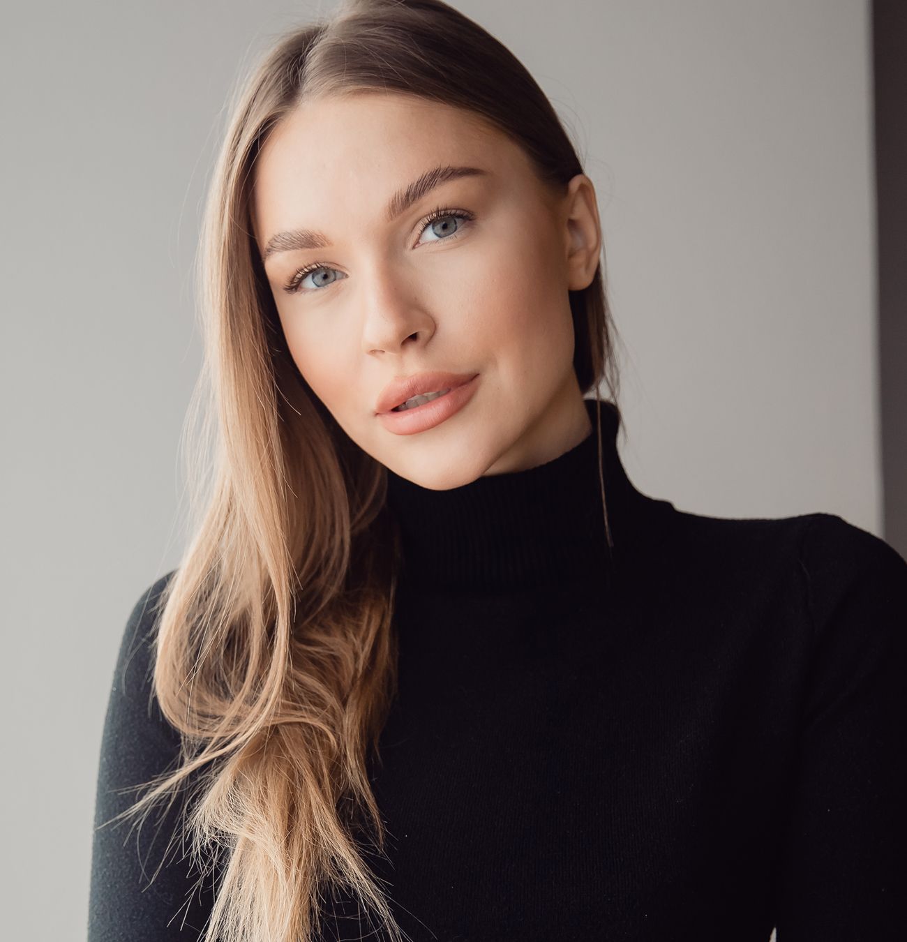 Portrait of a woman with long hair.