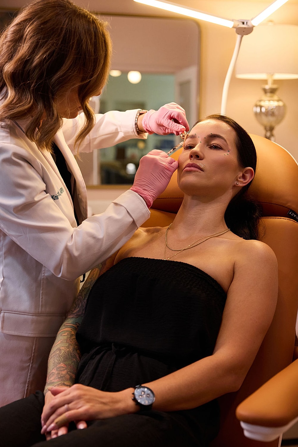 Client receives cosmetic treatment in a clinic.