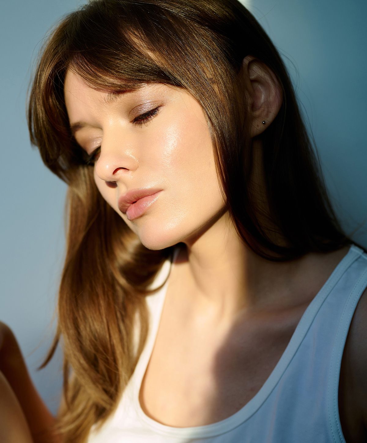 Portrait of a woman with long brown hair.