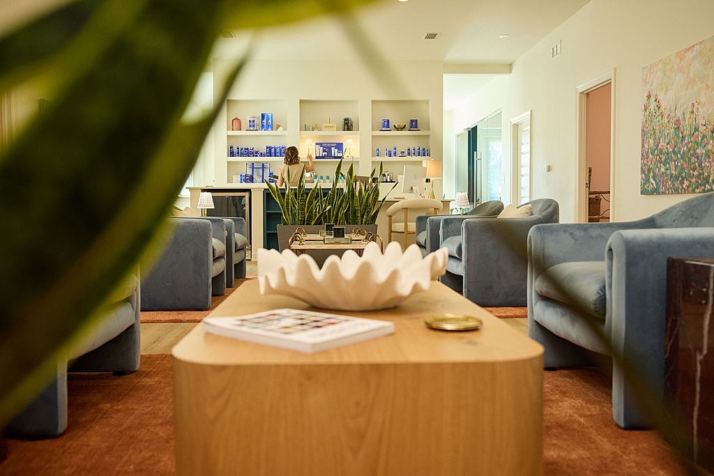 Modern spa interior with stylish seating and decor.