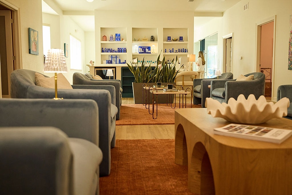 Modern lounge with blue furniture and decor.