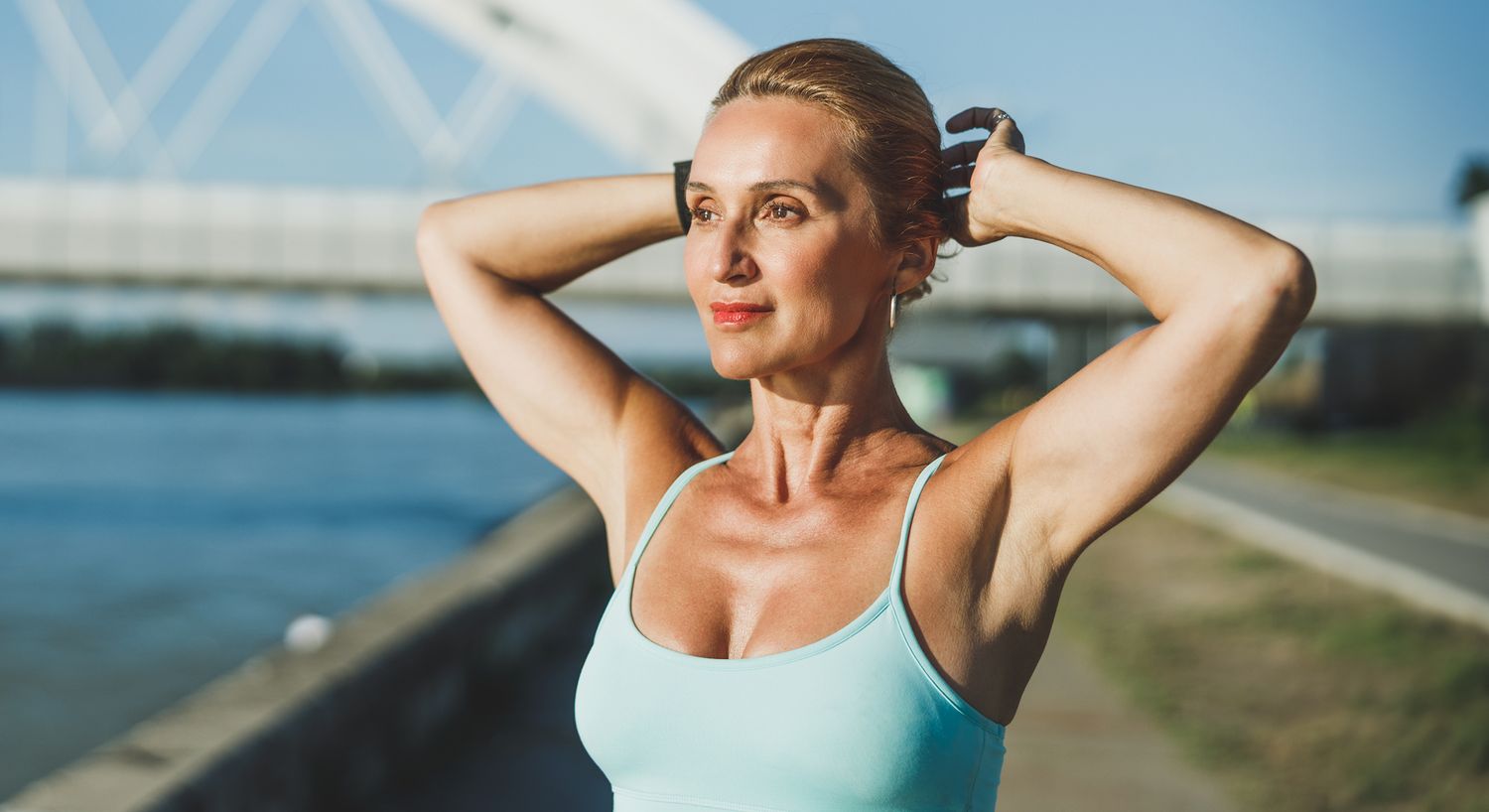 Active woman enjoying outdoors by the water.